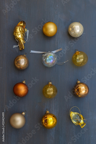 Christmas golden decorations on dark wooden background