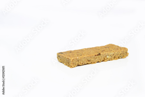 Snack protein raisin bar isolated on white