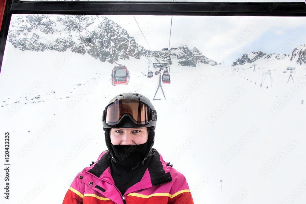 Portrait of young skier, teenage girl, in a cable car at alpine Portrait of young skier, teenage girl, in a cable car at alpine