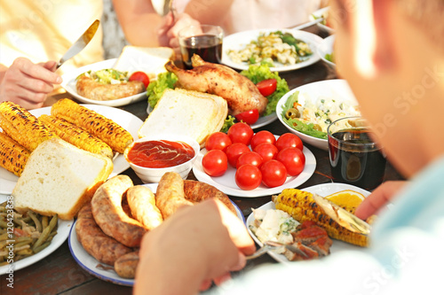 Friends eating on picnic