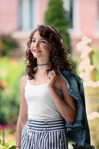 Beautiful young girl in garden