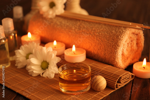 Obraz na plátne Beautiful spa set with flowers on wooden table