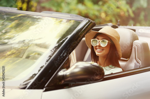 Beautiful woman driving car...