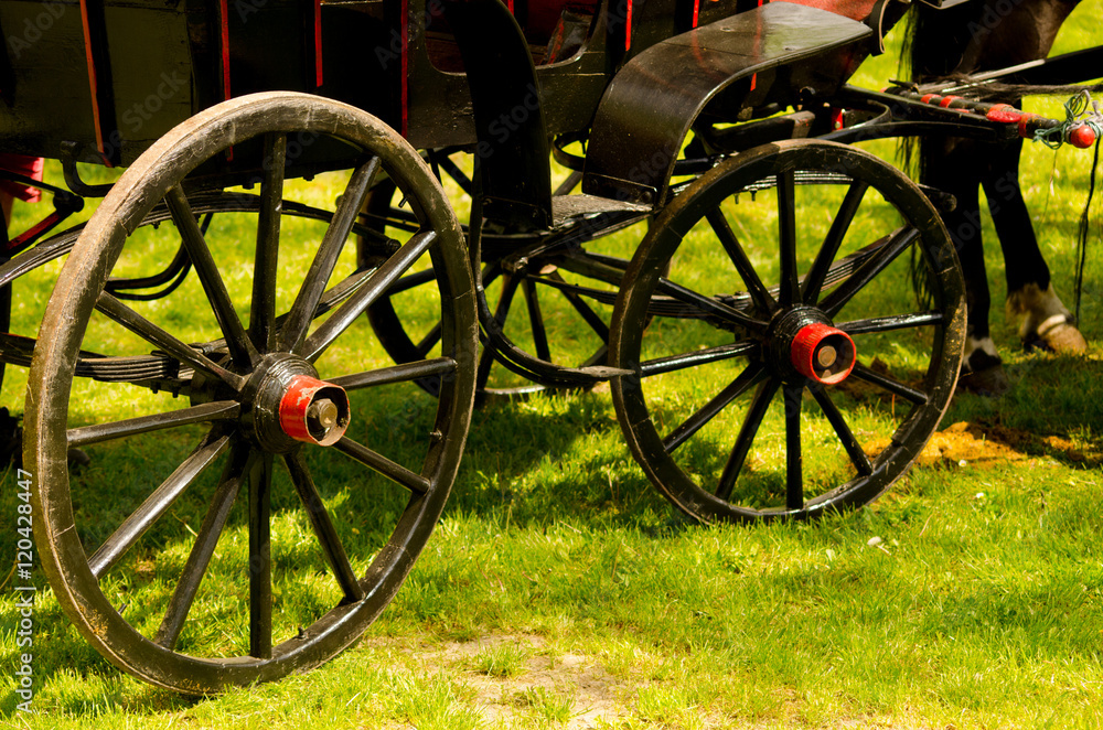 Old vintage carriage in black and red colors