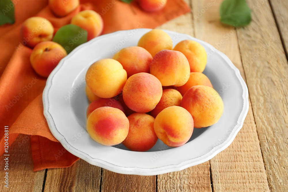 Fresh apricots on plate