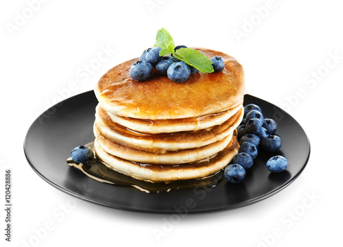 Tasty pancakes with blueberries on plate, isolated on white