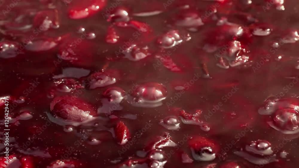 Plum jam cooking - ripen plums boiling in large pot; close-up; Plum jam cooking - ripen plums boiling in large pot; close-up;