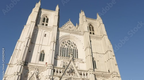 In front of blue sky Gothic art facade of religious monument 4K 2160p 30fps UltraHD footage - Famous cathedral in the city center Saint-Nicolas de Nantes 3840X2160 UHD video  photo