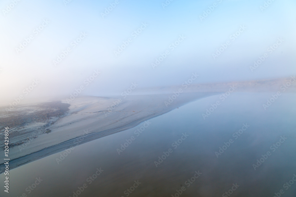 Foggy coast of Normandy in sunrise, light spectacle
Foggy coast of Normandy in sunrise, light spectacle