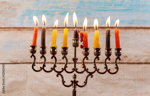 Jewish holiday Hanukkah creative background with menorah.