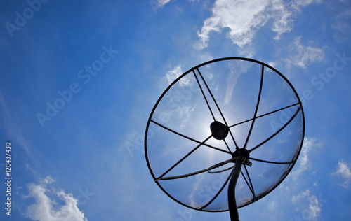 black antenna communication satellite dish over cloud and blue sky