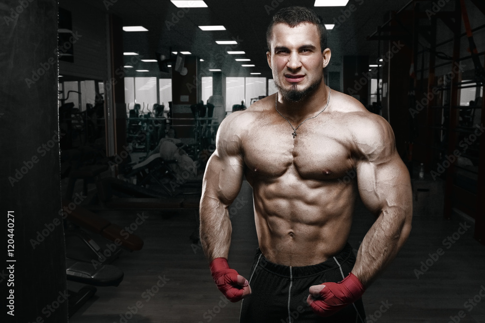 Fototapeta premium Fighter boxer on black background