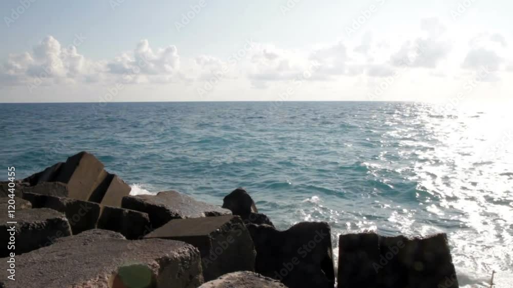 Adriatic Sea, Calabria, Italy sea with breakwater and blue sky with clouds Adriatic Sea, Calabria, Italy sea with breakwater and blue sky with clouds