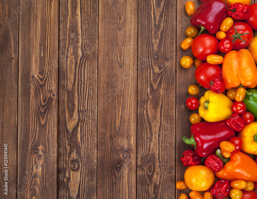 Colorful vegetables on wooden table or background