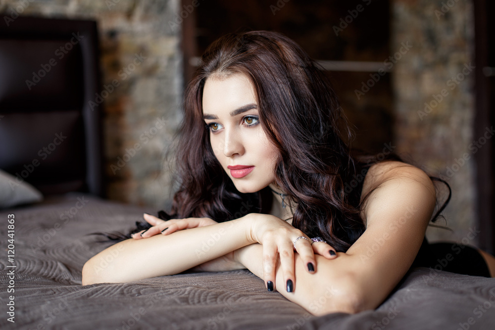 Naklejka premium portrait of a girl with curved black hair