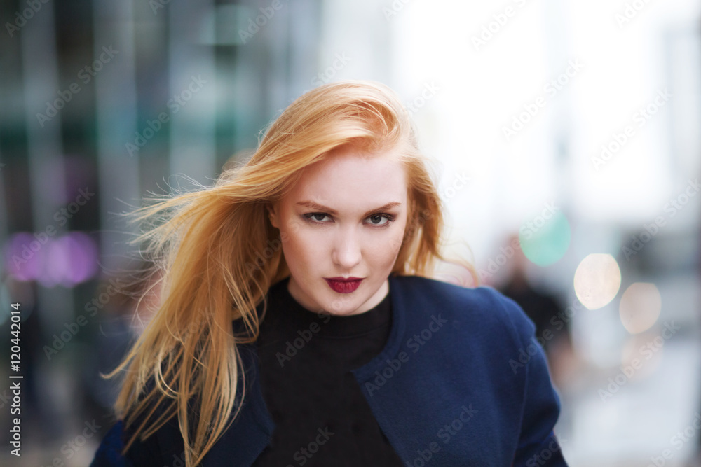 Portrait young beautiful haired woman, on street background
Portrait young beautiful haired woman, on street background