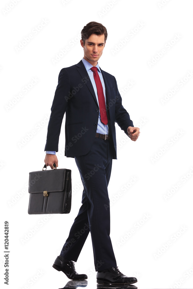 attractive businessman with suitcase stepping forward attractive businessman with suitcase stepping forward