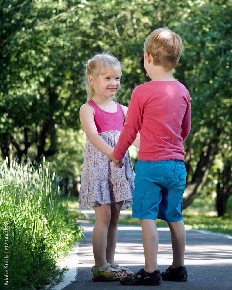 Little Boy And Girl In Love Holding Hands