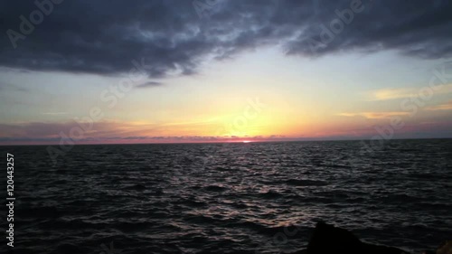 Beautiful sunset on the beach, incredible colors and clouds, panoramic. Adriatic Sea, Italy, Amantea Calabria.