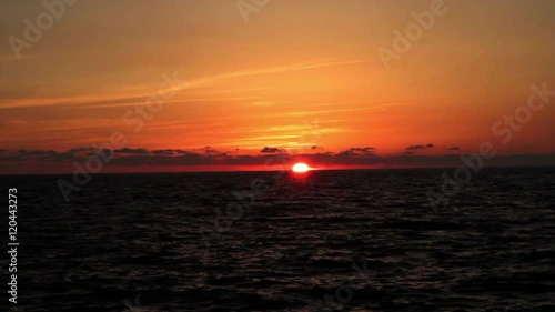 Beautiful sunset on the beach, incredible colors and clouds, panoramic. Adriatic Sea, Italy, Amantea Calabria.