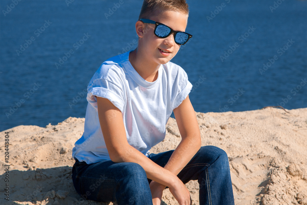boy in sunglasses at the beach