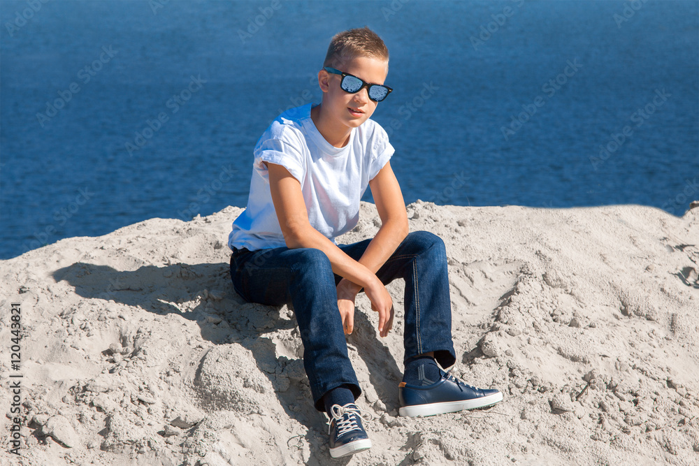 boy in sunglasses on the beach