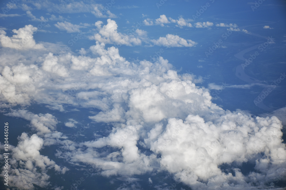 View of the sky and clouds from the airplane window View of the sky and clouds from the airplane window