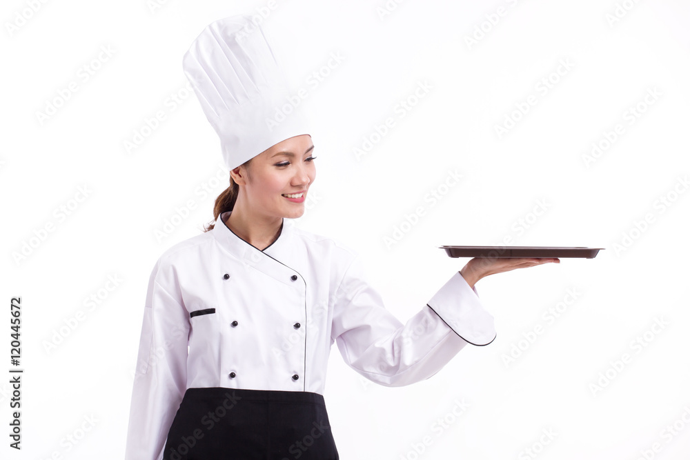happy, smiling, positive female chef pointing up blank food tray happy, smiling, positive female chef pointing up blank food tray