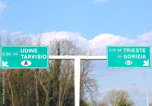 Road Sign in the motorway junction in Northen Italy with crossro photo