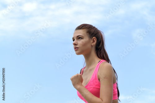 Close-up portrait of a girl preparing to run