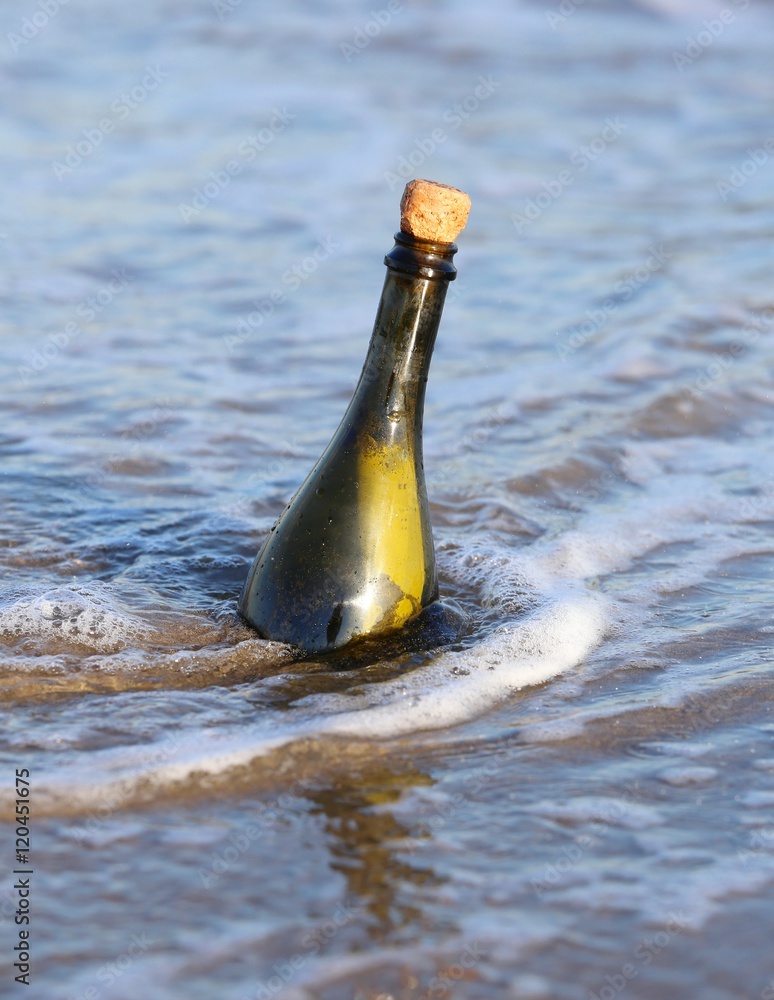 bottle in the ocean with a message bottle in the ocean with a message