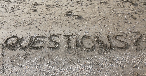 QUESTIONS written on the beach