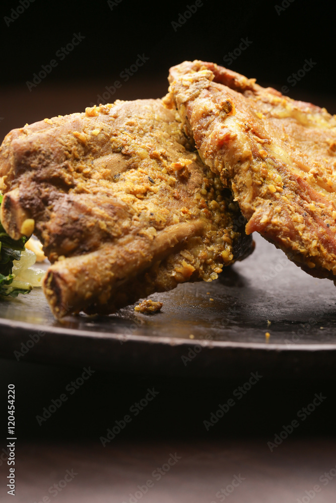 Pork ribs on a dark background Pork ribs on a dark background