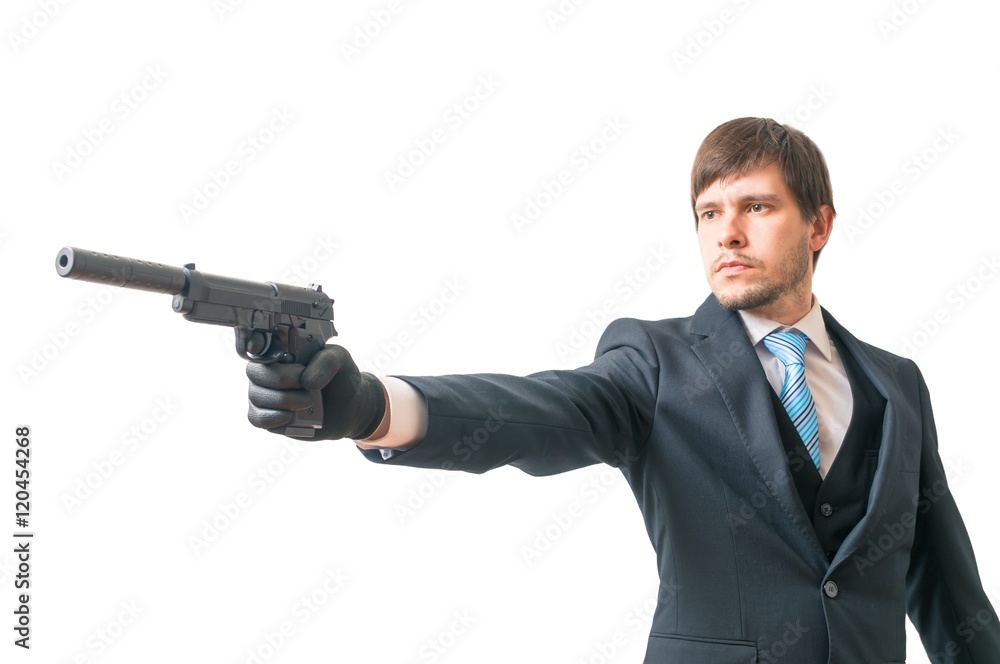 Secret agent is aiming with pistol with silencer. Isolated on white background. Secret agent is aiming with pistol with silencer. Isolated on white background.