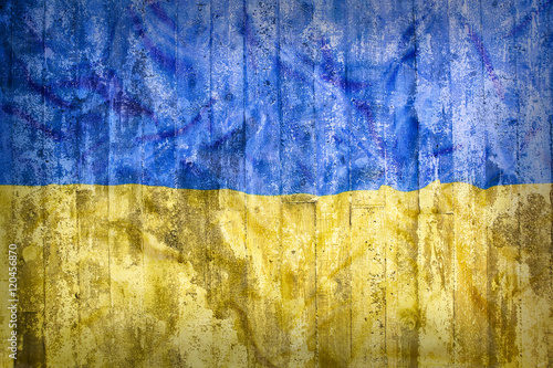 Fototapet Grunge style of Ukraine flag on a brick wall