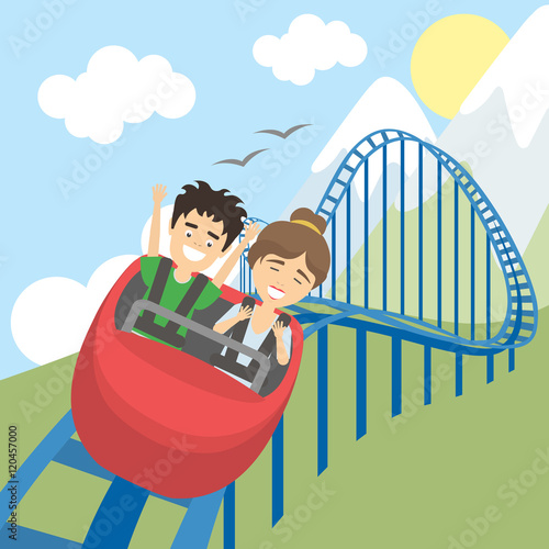 Rollercoaster in amusement park. Young smiling man and woman have fun on the roller coaster. Scary but funny entertainment.