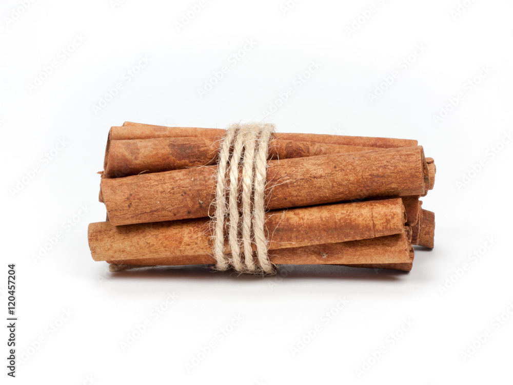 Tied bunch of cinnamon sticks isolated on white background Tied bunch of cinnamon sticks isolated on white background
