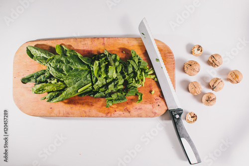 Schilderij op canvas Vegetarian salad with spinach cabbage and walnuts. lay flat