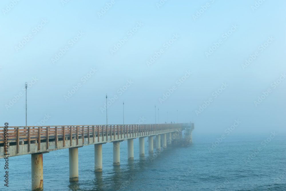 Pier in the fog in Zelenogradsk on the Baltic sea