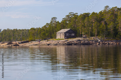 wooden house on the northern rocky shore