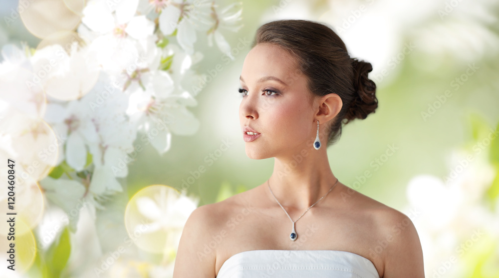 beautiful asian woman with earring and pendant beautiful asian woman with earring and pendant