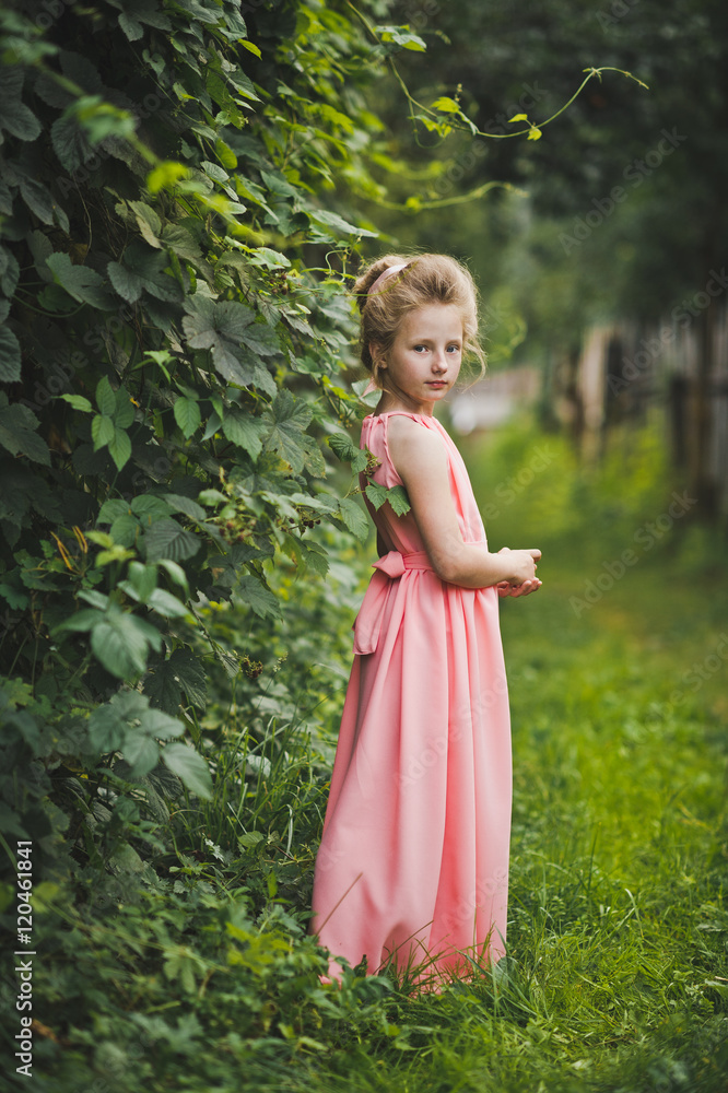 A childs portrait set amidst a blossomed garden 6659. A childs portrait set amidst a blossomed garden 6659.