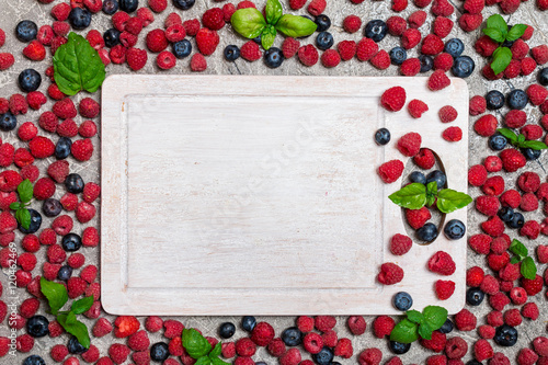 Berries frame on concrete background