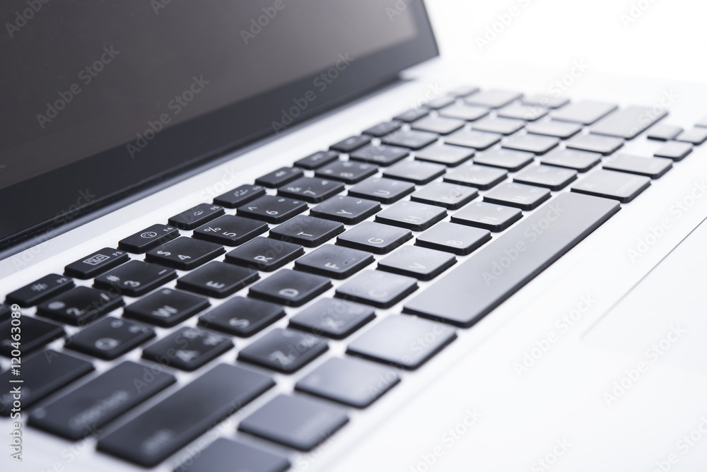Close up computer keyboard on desktop office of a modern laptop.