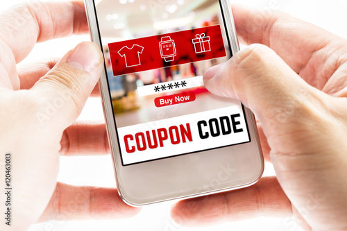 Close up Two hand holding mobile phone with coupon code word and