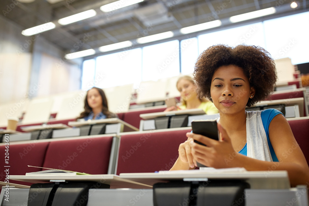 african student girl with smartphone at lecture african student girl with smartphone at lecture