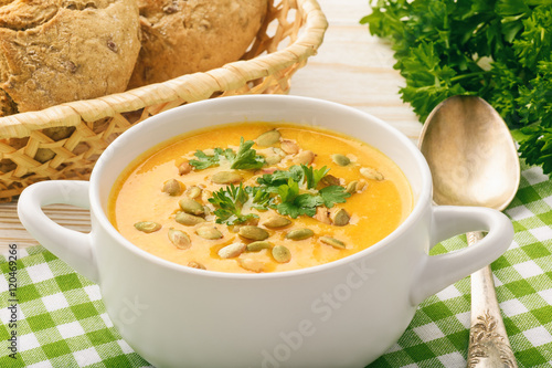 Vegetarian meal - cream carrot soup with pumpkin seeds. 