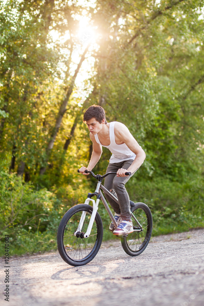 Boy on bike make the bunny hop trick Boy on bike make the bunny hop trick