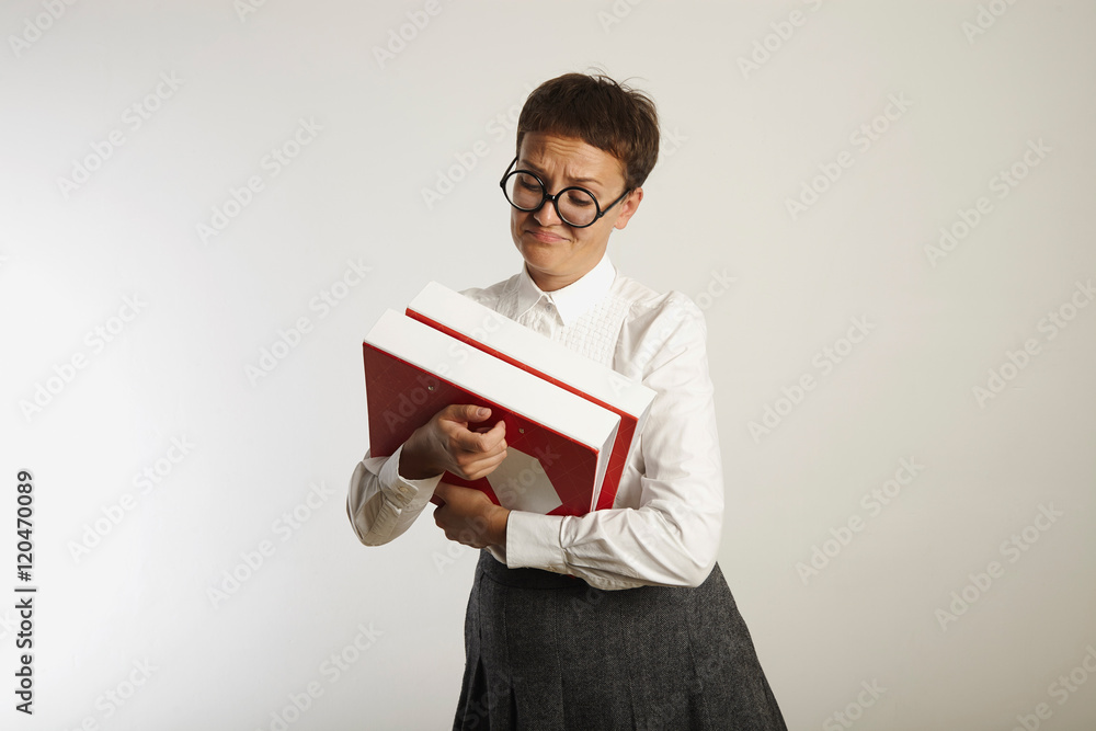 Portrait of a tired teacher with binders Portrait of a tired teacher with binders
