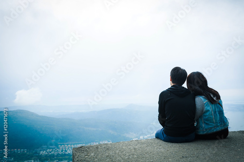 Two hikers relaxing on top of hill in Bergen